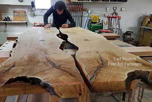 Earl designing notch for glass on mesquite slabs for custom made live edge dining table